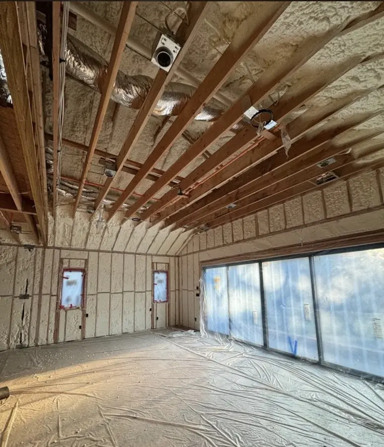 Interior walls and ceiling insulated with spray foam during new construction in Naples